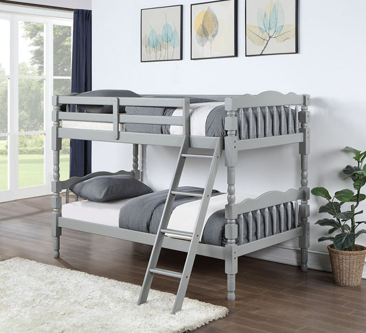 The Homestead - Bunk Bed, Durable Construction, in gray wood, is displayed in a bright bedroom with gray and white bedding, wood flooring, a white rug, potted plant, framed leaf art on the wall, and natural light from a window.