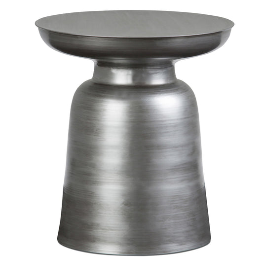 The Toby Handcrafted Metal Accent Table features a modern, round design with a brushed silver finish and sculpted pedestal base, highlighted by smooth, slightly curved lines.