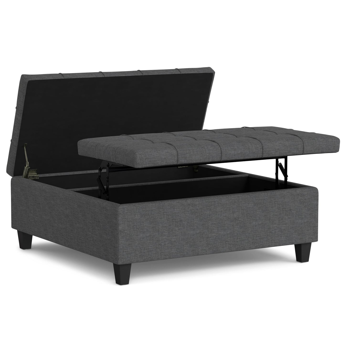 The Harrison Upholstered Coffee Table Storage Ottoman features a gray tufted lift-top lid with an open storage compartment inside, and stands on short black legs.