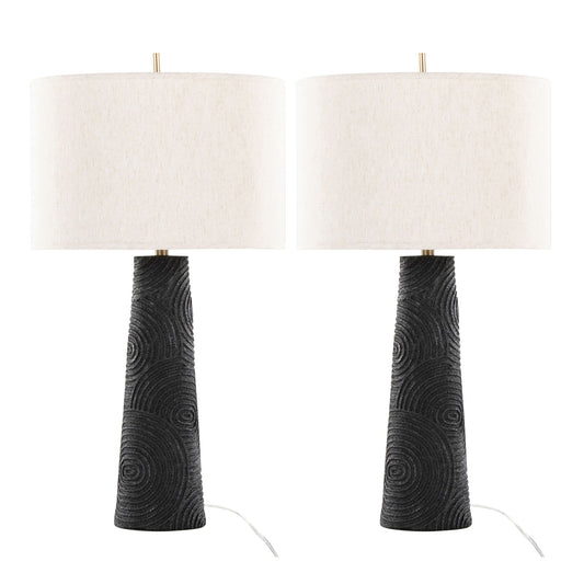 Set of 2 Kona Contemporary Table Lamps with textured matte black bases featuring circular patterns and large white drum lampshades. Visible cords at the base. Finish: Matte Black/Modern Brass/Natural.