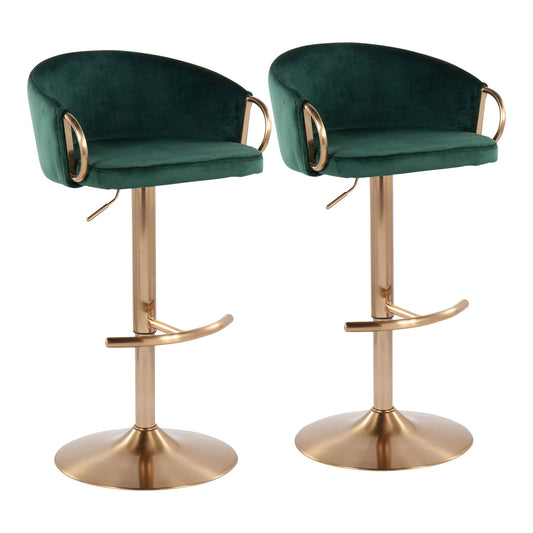 The Claire - Contemporary / Glam Adjustable Bar Stool (Set of 2) features green velvet seats, curved backrests, gold metal armrests and footrests, and round gold pedestal bases, shown against a white background.