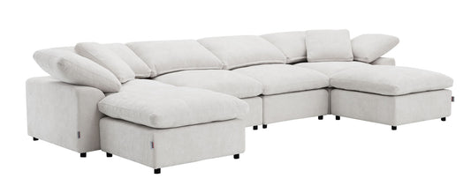 The Naveen Modular Sectional With Ottoman is a large, light gray sofa with wide cushions, adjustable headrests, black legs, and a modern low-profile design, shown on a white background.