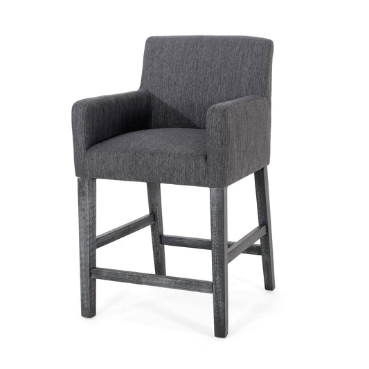 The Serenitia - Upholstered Counter Chair With Straight Arm features a modern dark gray upholstered seat, back, and arms, complemented by wooden legs and footrests in a matching dark finish for a simple, contemporary look.