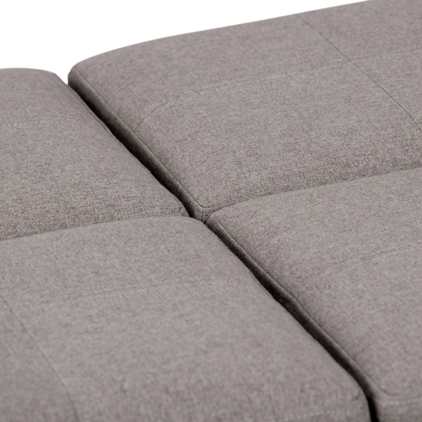 Close-up view of the Avalon Square Coffee Table Storage Ottoman featuring four light gray, fabric-upholstered cushions with visible seams and a soft texture, arranged in a square.