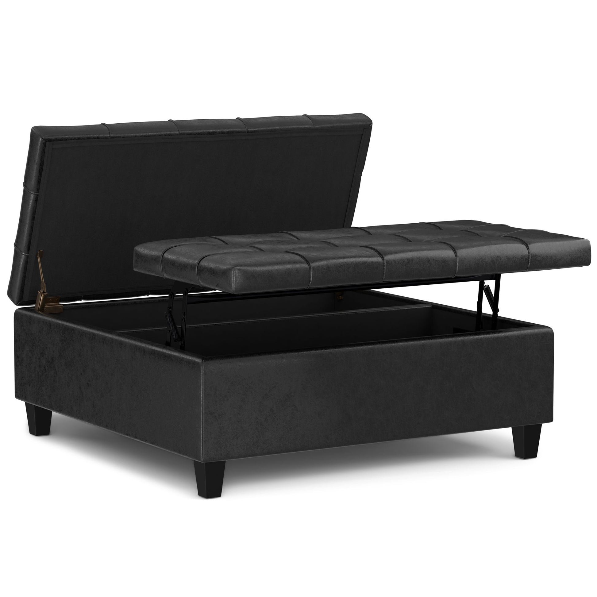The Harrison Upholstered Coffee Table Storage Ottoman features a black, rectangular design with a faux leather finish, short legs, and a padded tufted lid that lifts to reveal spacious storage inside.