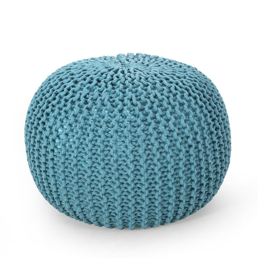 The Moro Knitted Cotton Round Pouf features a pumpkin shape and chunky knit texture in teal, displayed on a white background.