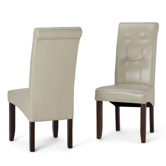 The Cosmopolitan - Deluxe Tufted Parson Upholstered Chair (Set of 2) features two beige leather chairs with dark wooden legs; one is shown from the front and one from the back, highlighting button-tufted backrest detailing.
