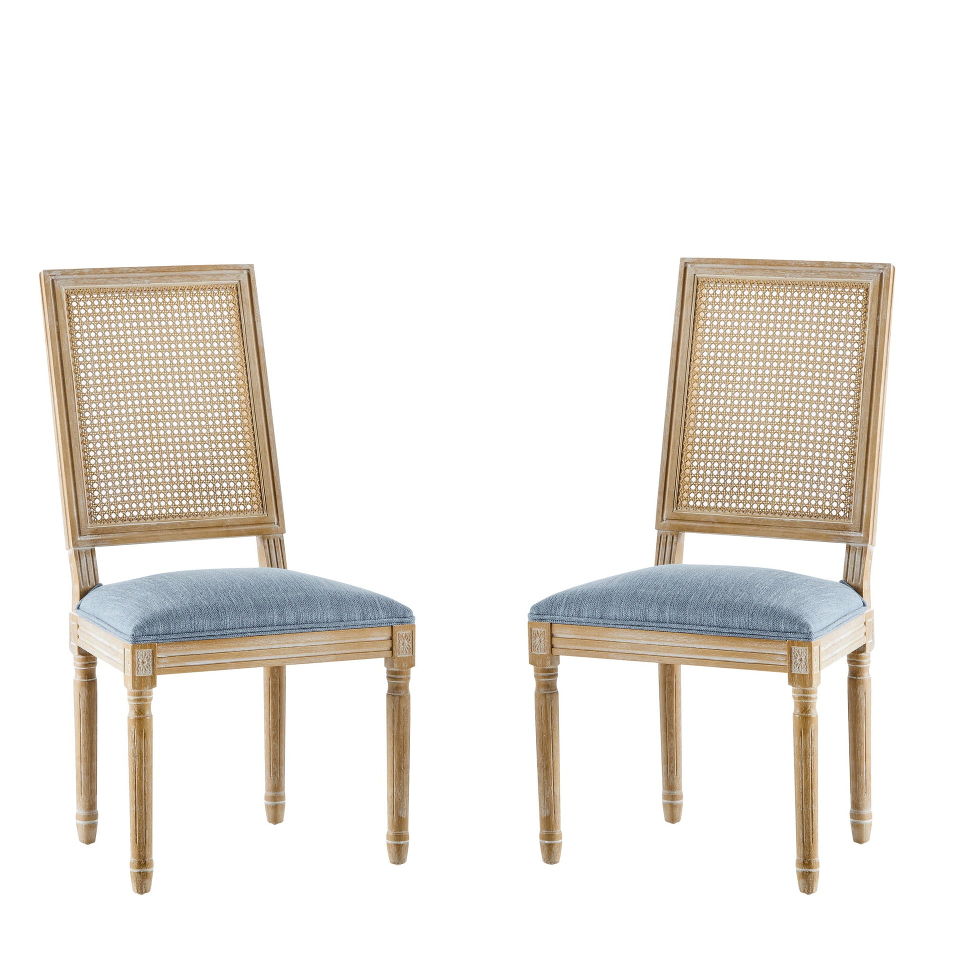 Two French Country Dining Chairs with rectangular cane backrests and smooth upholstered seats are positioned facing each other against a white background.
