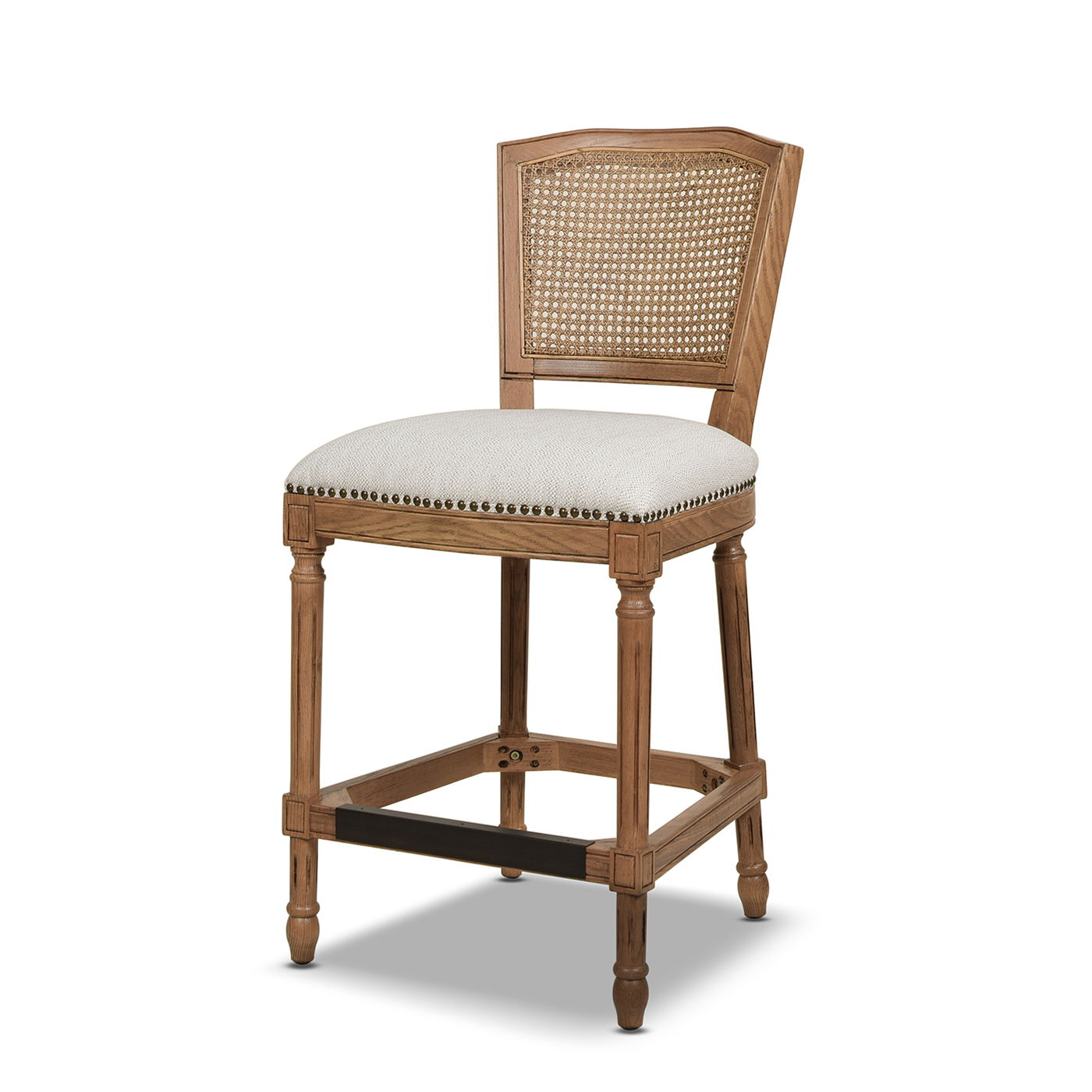 The Triomphe Rattan Wicker High Back Armless Counter Bar Stool features a cane backrest, light beige upholstered seat with nailhead trim, carved natural wood legs, and a footrest for added comfort.
