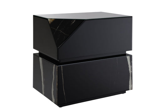 The Drisana Mirrored End Table in black features a modern geometric design with a glossy finish and subtle marble-like white streaks. Its angular top section gives it a dynamic, asymmetrical look.