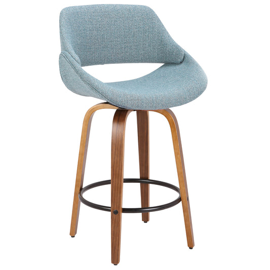 The Fabrico - Mid Century Inviting Design Modern Counter Stool features a curved, light blue upholstered seat with a low backrest and open lower back, set on wooden legs with a black circular footrest.