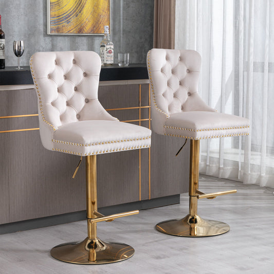 A pair of thick golden swivel velvet barstools with tufted backs and adjustable seat heights (25-33") are placed in front of a modern gray bar, creating a stylish setting for home, pub, or kitchen island.