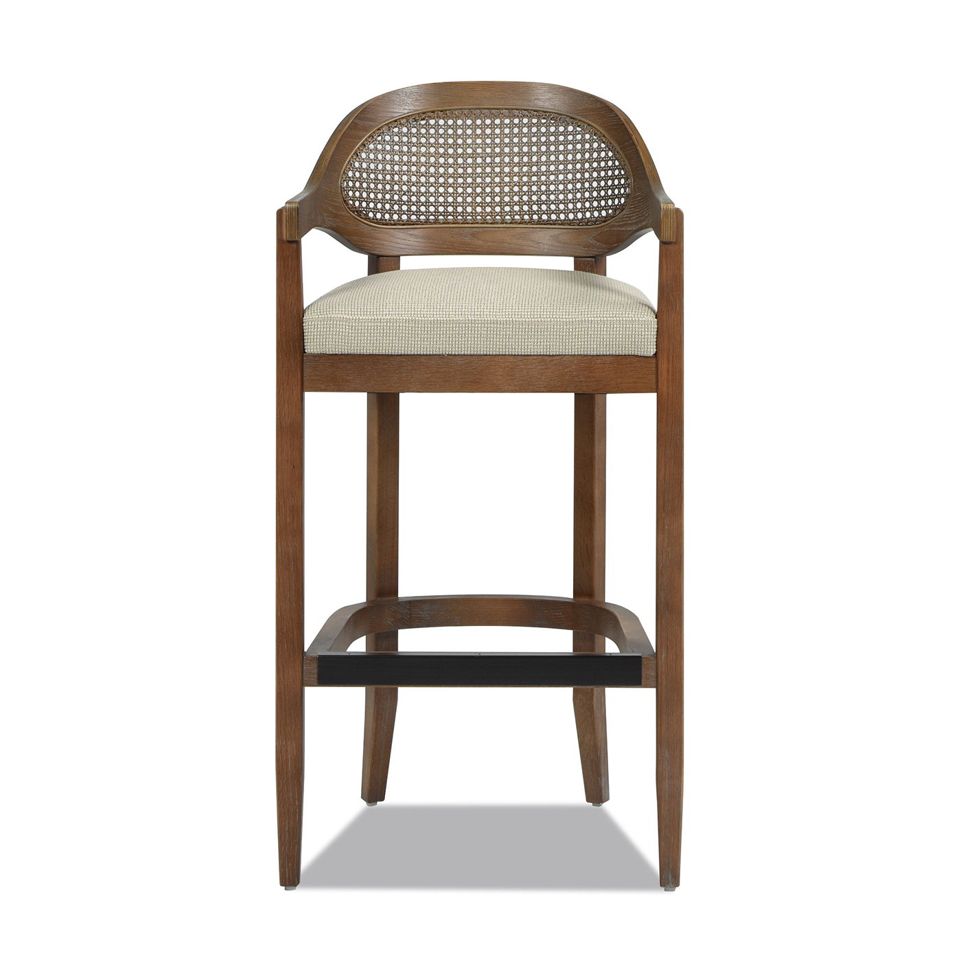 The Americana Mid-Century Modern Cane Back Counter Stool features a wooden frame, woven rattan backrest, cushioned light fabric seat, four tapered legs, and a footrest.