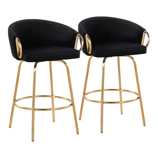 The Claire Contemporary & Glam Counter Stool set includes two stools with black cushioned seats and backs, gold metal frames, circular footrests, and gold arm accents, shown side by side on a white background.