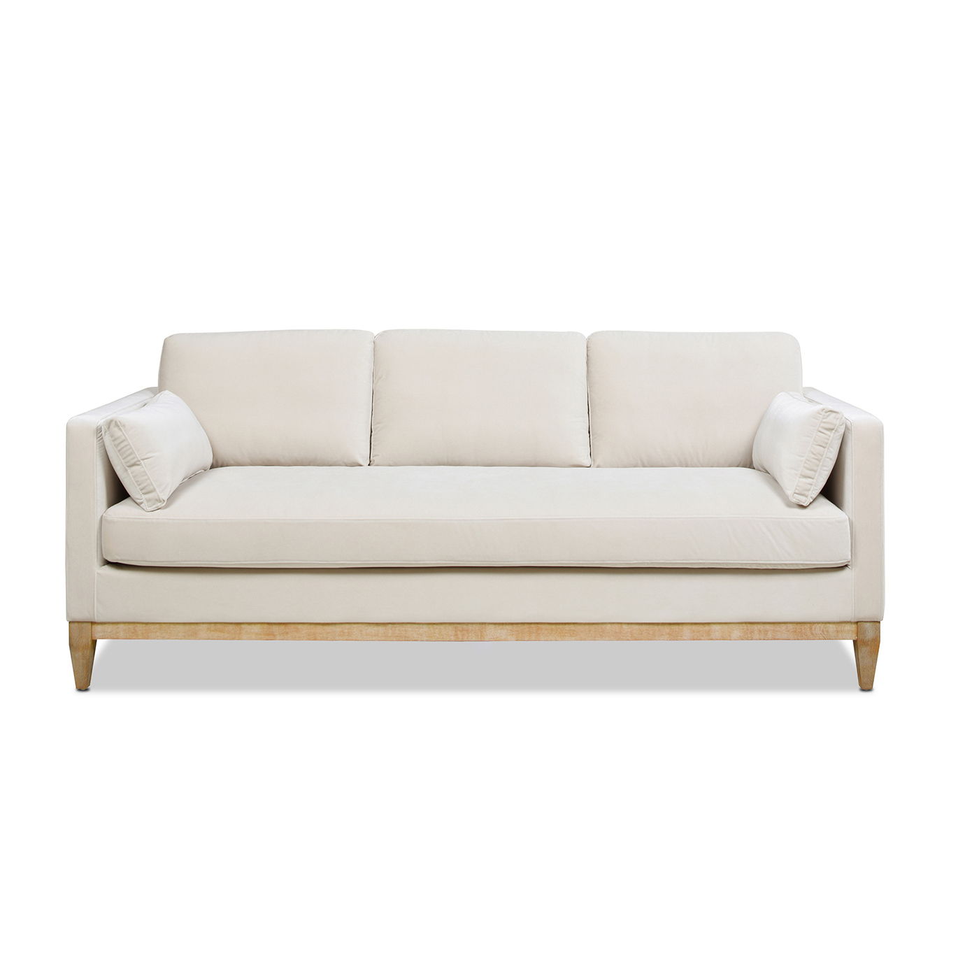 The Knox - Modern Farmhouse Sofa features a modern beige design with three cushions, wooden legs, and two matching side pillows, shown from the front against a white background.