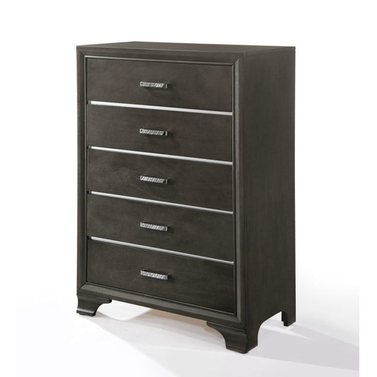 The Carine II Chest in gray features five drawers with simple metal handles, a rectangular shape, and short bracket feet, displayed against a white background.