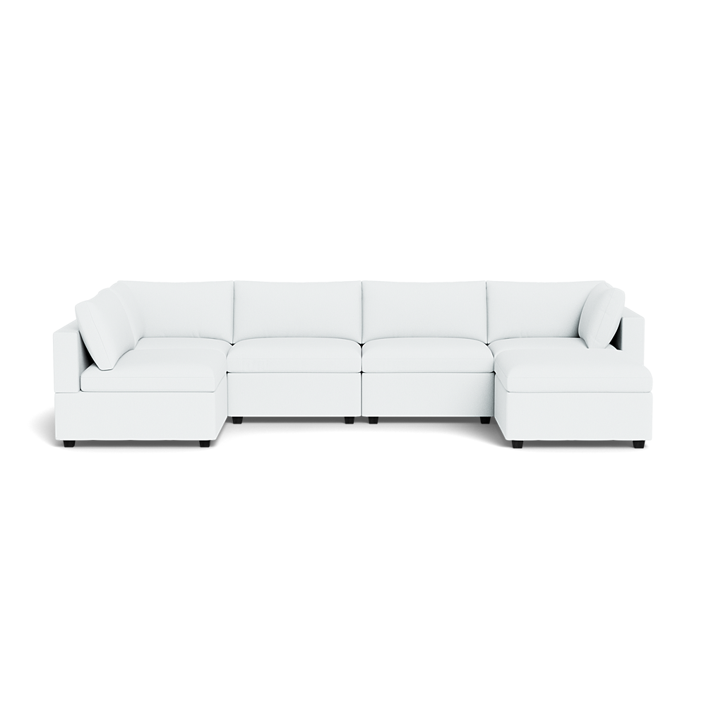 The Kova Box Cushion U-Shape is a large, modern white sectional sofa with clean lines, low backrests, and multiple connected seats including corner sections.