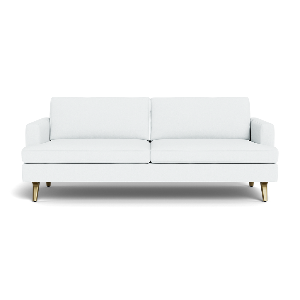 The Lido Sofa 75" is a modern white sofa with two seat and back cushions, low square armrests, and angled wooden legs tipped with gold, shown from the front against a black background.