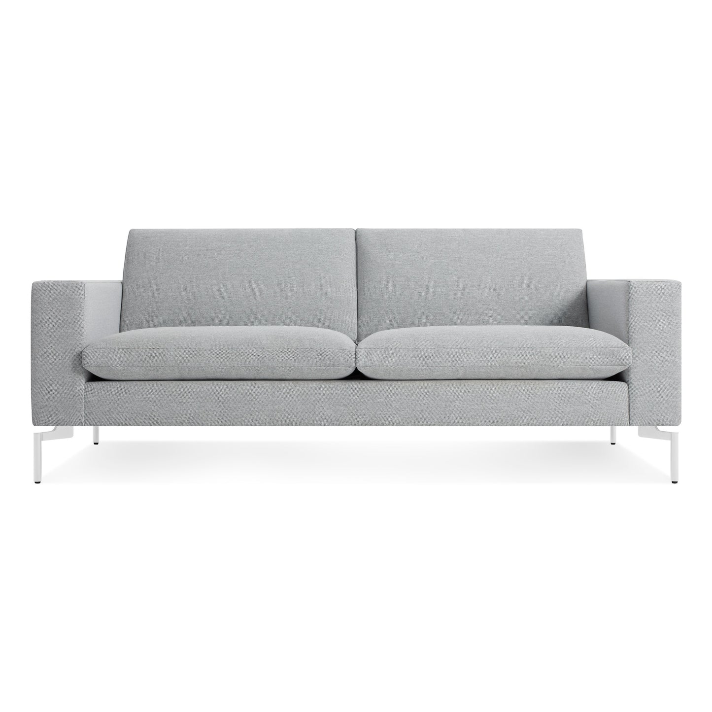 The New Standard 78" Sofa in Maharam Mode Intaglio/White features a modern light gray design with straight armrests, plush seat and back cushions, and white metal legs, displayed against a plain white background.