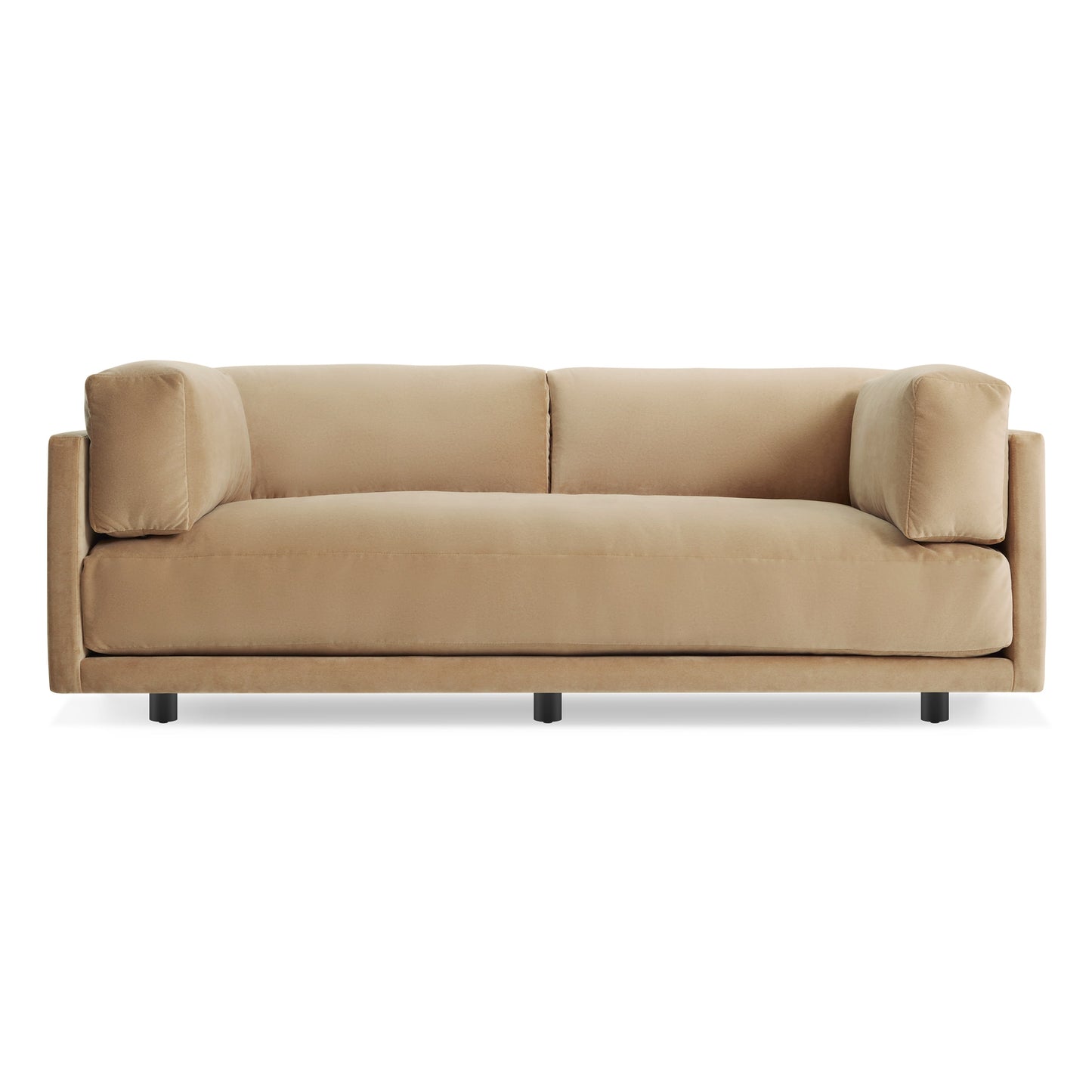 The Sunday 82" Sofa in camel velvet features wide armrests, plush cushions, and a minimalist design, showcased against a plain white background.