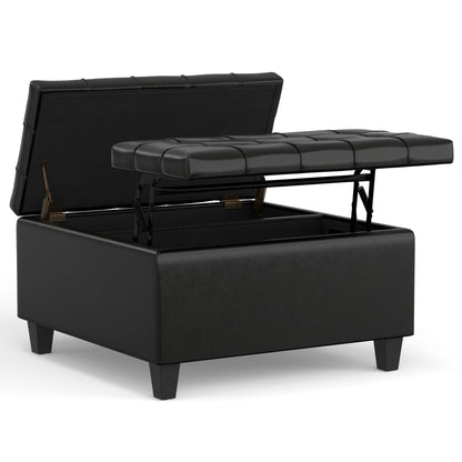 The Harrison Upholstered Coffee Table Storage Ottoman is a black, square piece with a tufted lift-top lid that opens to reveal storage space. It features short, sturdy legs and a modern, sleek design.