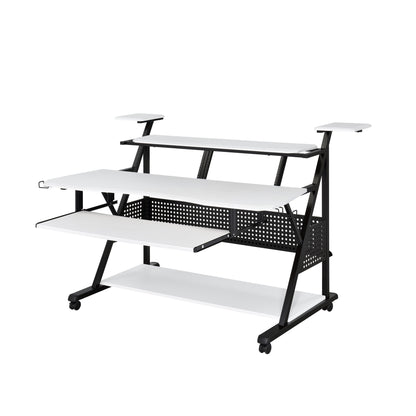 The Willow - Versatile Music Desk features a sleek black and white design with multiple shelves, elevated monitor stands, a spacious main surface, lower shelf, perforated metal back panel, all supported by a black wheeled frame.