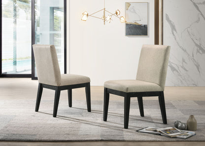 A set of two Jasper Contemporary Fabric 19" Dining Chairs in beige, featuring dark wooden legs, face each other on a gray rug in a modern room with large windows, a contemporary light fixture, and stylish decor.