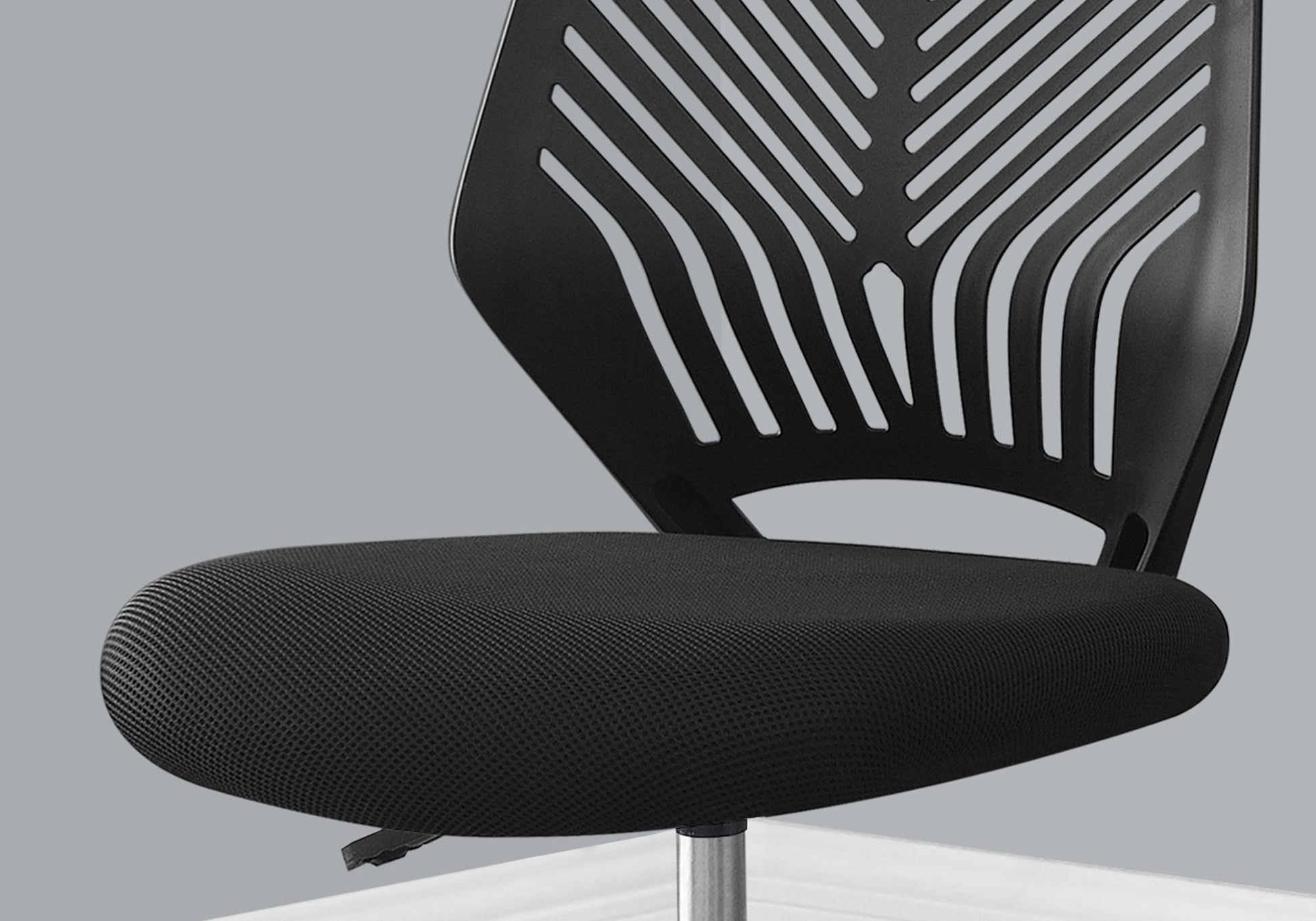 The Office Chair features an ergonomic design with adjustable height, a textured seat, and a ventilated patterned backrest in sleek black, set against a gray background.