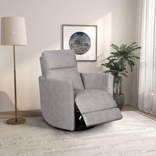 A modern living room features the Lawson Swivel Glider Suede Recliner Chair in Latte, a tall floor lamp, potted plant, framed wall art, sheer white curtains allowing natural light in, and a light-colored rug.