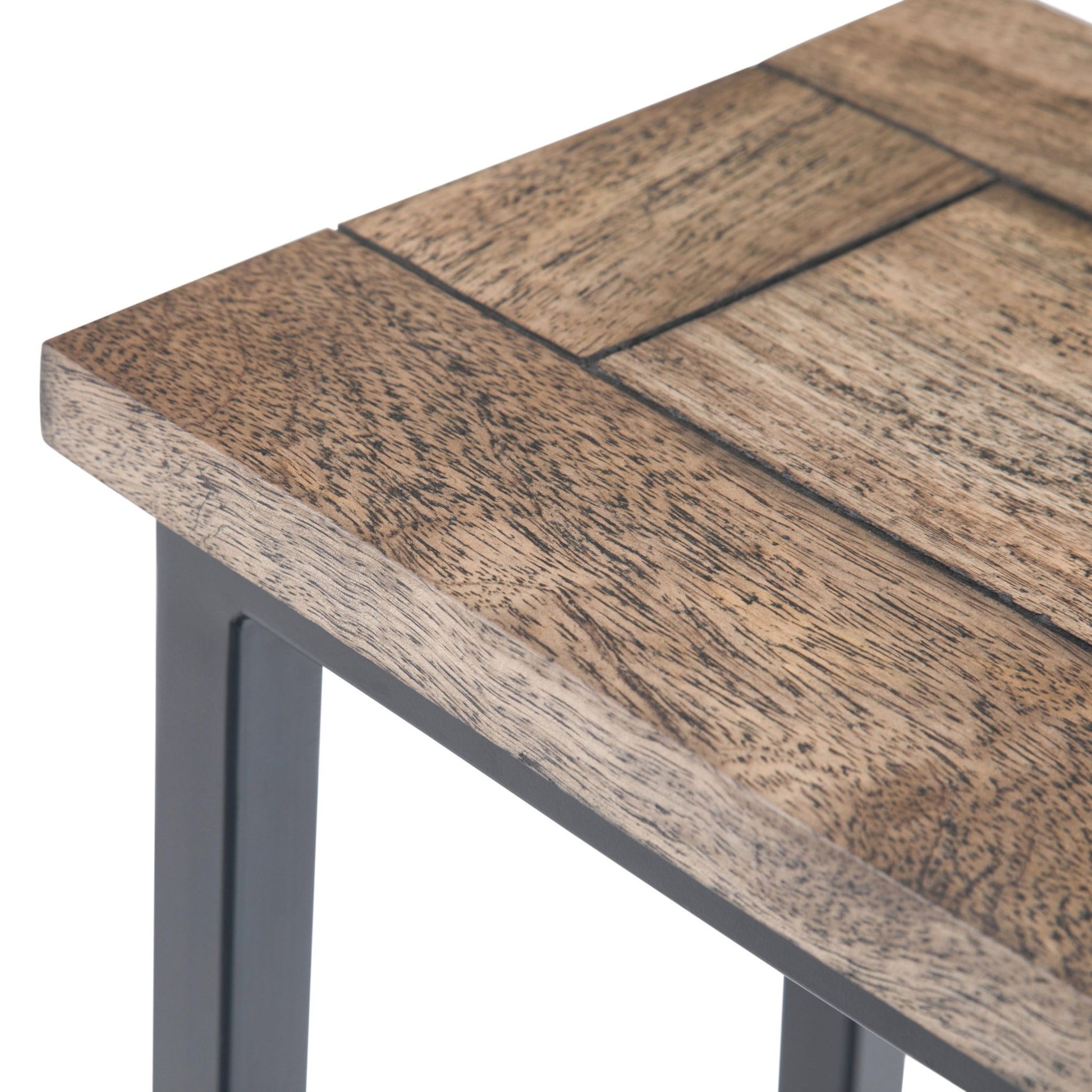 Close-up of the Skyler - C Side Handcrafted Table’s corner, highlighting its natural textured wooden top, visible wood grain, rectangular panel design, and sturdy metal frame leg.