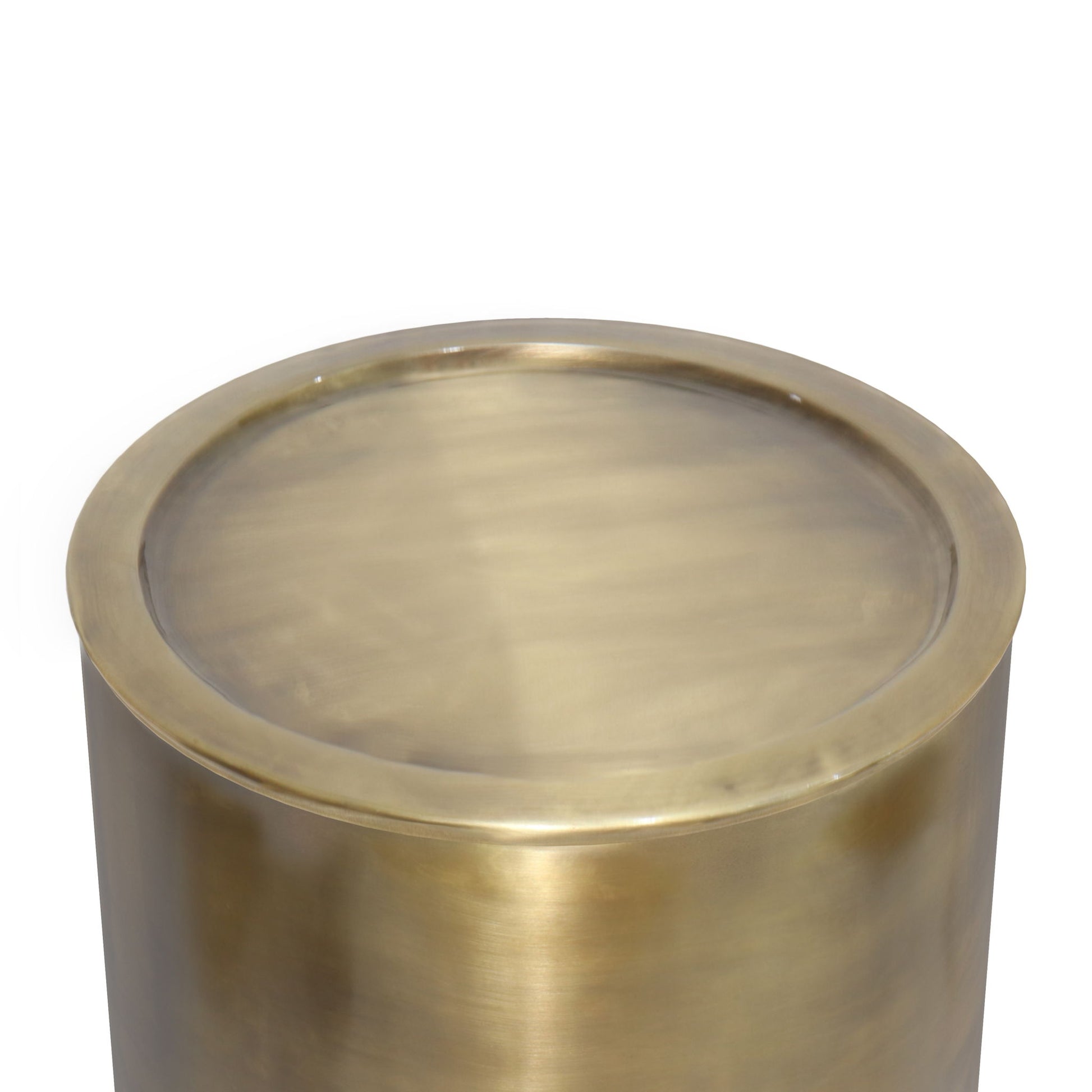 A close-up of the Corbin - Handcrafted Metal Side Table, featuring a round, metallic brass design with a smooth, reflective surface and slightly raised edge, set against a white background.
