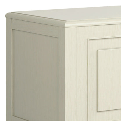 A close-up view of the Connaught Handcrafted Storage Bench Trunk showing its smooth, light wood finish and elegant recessed panel detailing.