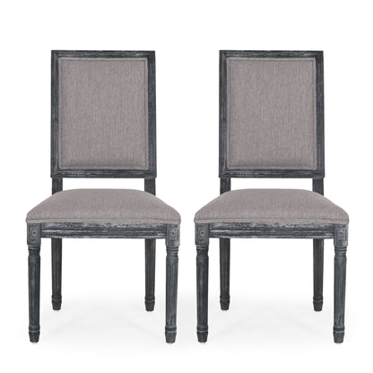 Two French Country Style Dining Chairs with fluted legs and upholstered light gray seats and backs, featuring dark gray frames, are positioned side by side facing forward against a white background.