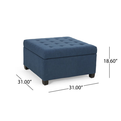 The Isabella Contemporary Ottoman With Storage features a blue square upholstered design with a tufted top, four black legs, and measures 31” L x 31” W x 18.6” H.