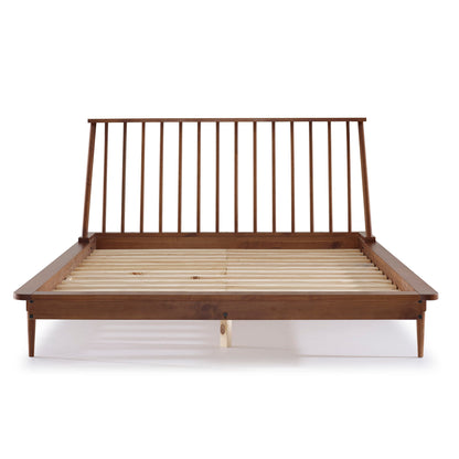 The Mid-Century Modern Solid Wood Platform Bed Frame With Spindle Headboard features a front view of its slatted headboard, platform base, tapered legs, and a warm brown finish in classic mid-century modern style.