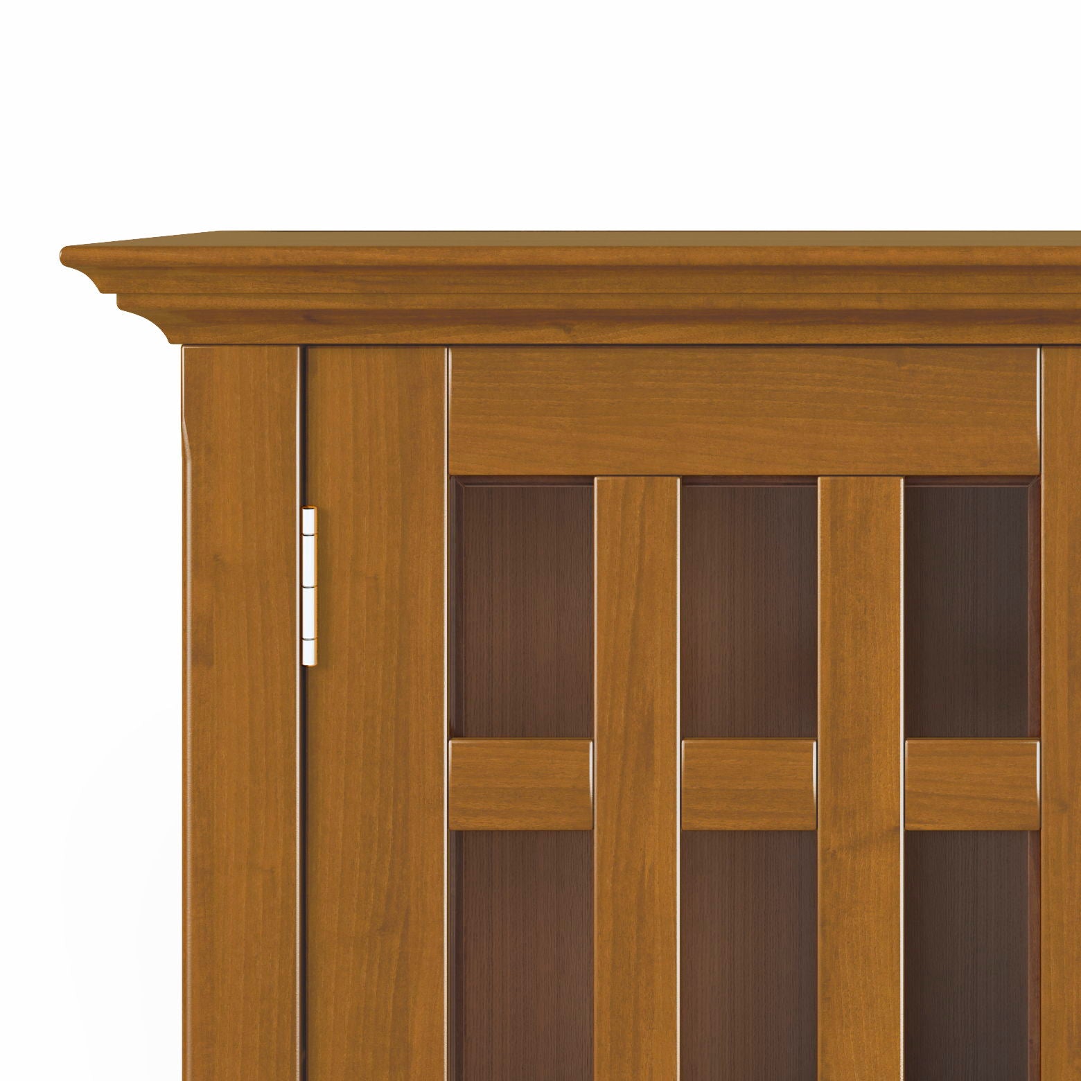 Close-up of the upper left corner of the Bedford - Storage Media Cabinet, featuring decorative crown molding and vertical rectangular glass panels framed in wood.