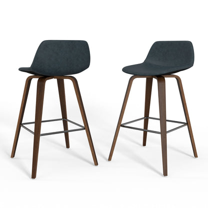 The Randolph Bentwood Counter/Bar Height Stool (Set of 2) features minimalist, contemporary design with dark curved seats, wooden legs, and metal footrests. Shown are two stools against a white background.
