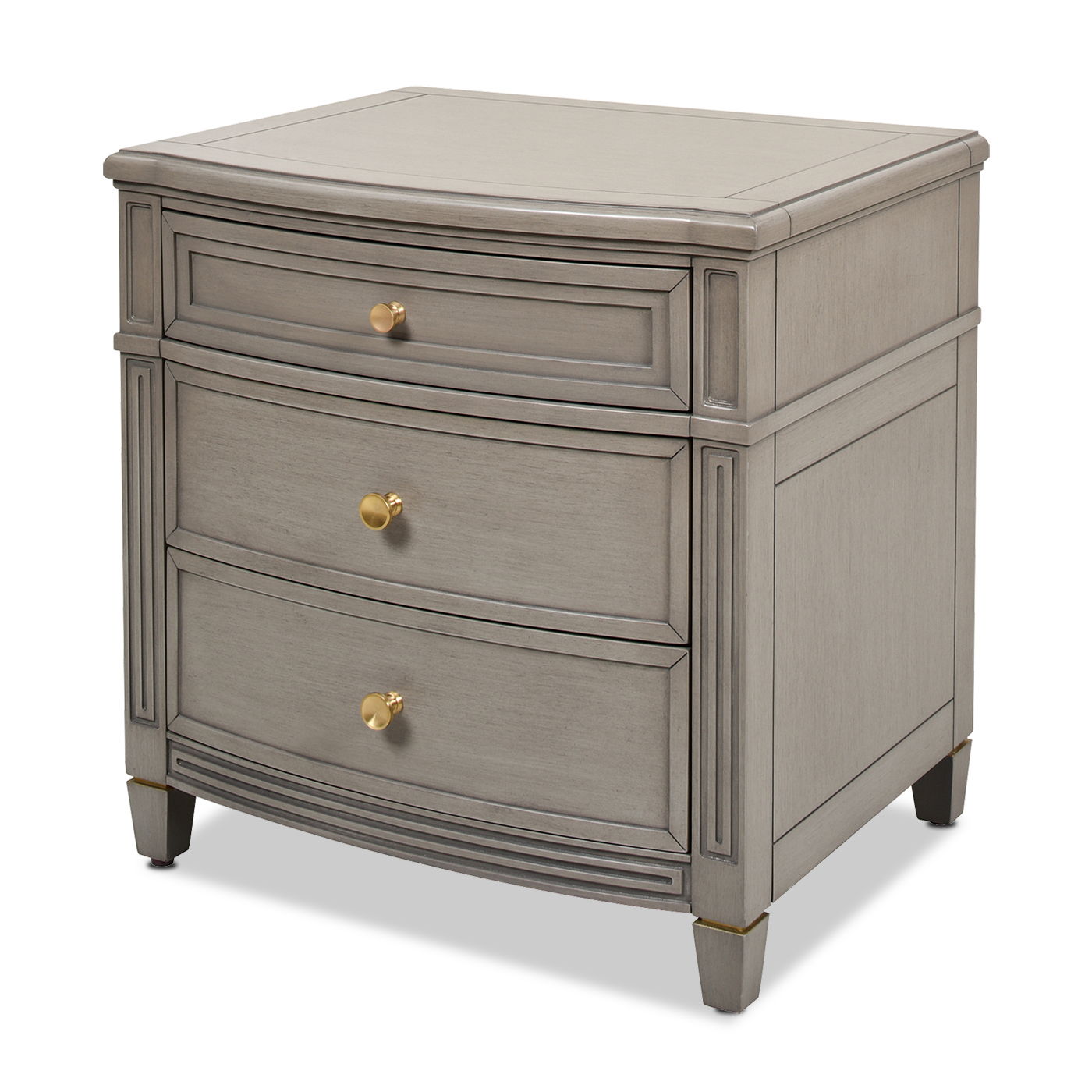 The Dauphin 3 Drawer Accent End Table is a gray wooden nightstand with three drawers, each featuring a round gold knob and slightly curved front panels, showcasing simple, classic detailing.