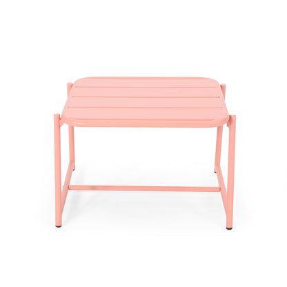 The Conrad - Side Table Outdoor is a small, square, light pink metal table featuring horizontal slats on top and simple straight legs.