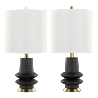 The Lloyd - Contemporary Table Lamp (Set of 2) features white cylindrical shades, black textured geometric bases, and gold accents at the top and bottom.