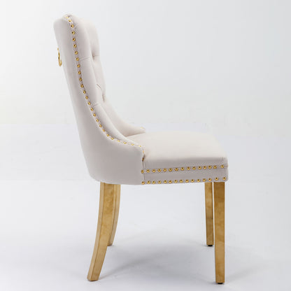 Side view of Nikki, a modern high-end dining chair set with luxe velvet upholstery, tufted backrest, nailhead trim, and solid wood legs accented with golden stainless steel plating, against a plain white background.