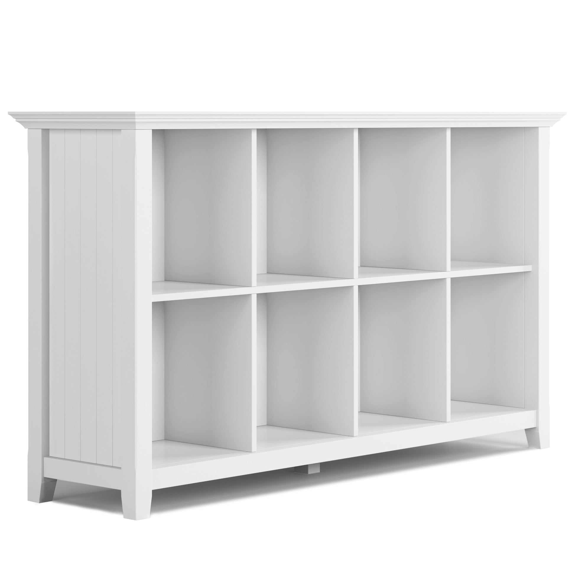 The Acadian - Handcrafted Cube Storage is a white wooden shelf with eight open square cubbies, shown at an angle. It features a simple, modern design with a flat top, vertical side panels, and slightly tapered legs.