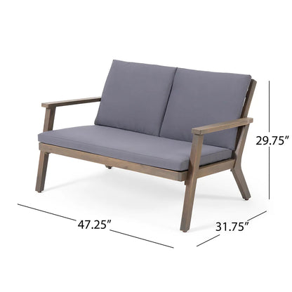 The Avacyn Outdoor Acacia Wood 4 Seater Chat Set features a wooden frame, gray seat and back cushions, armrests, and measures 47.25"W x 31.75"D x 29.75"H—perfect for stylish outdoor comfort.