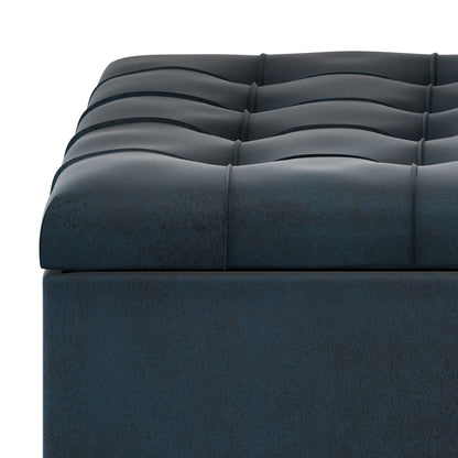 Close-up of the dark blue, tufted, cushioned surface on the Harrison Large Coffee Table Storage Ottoman.