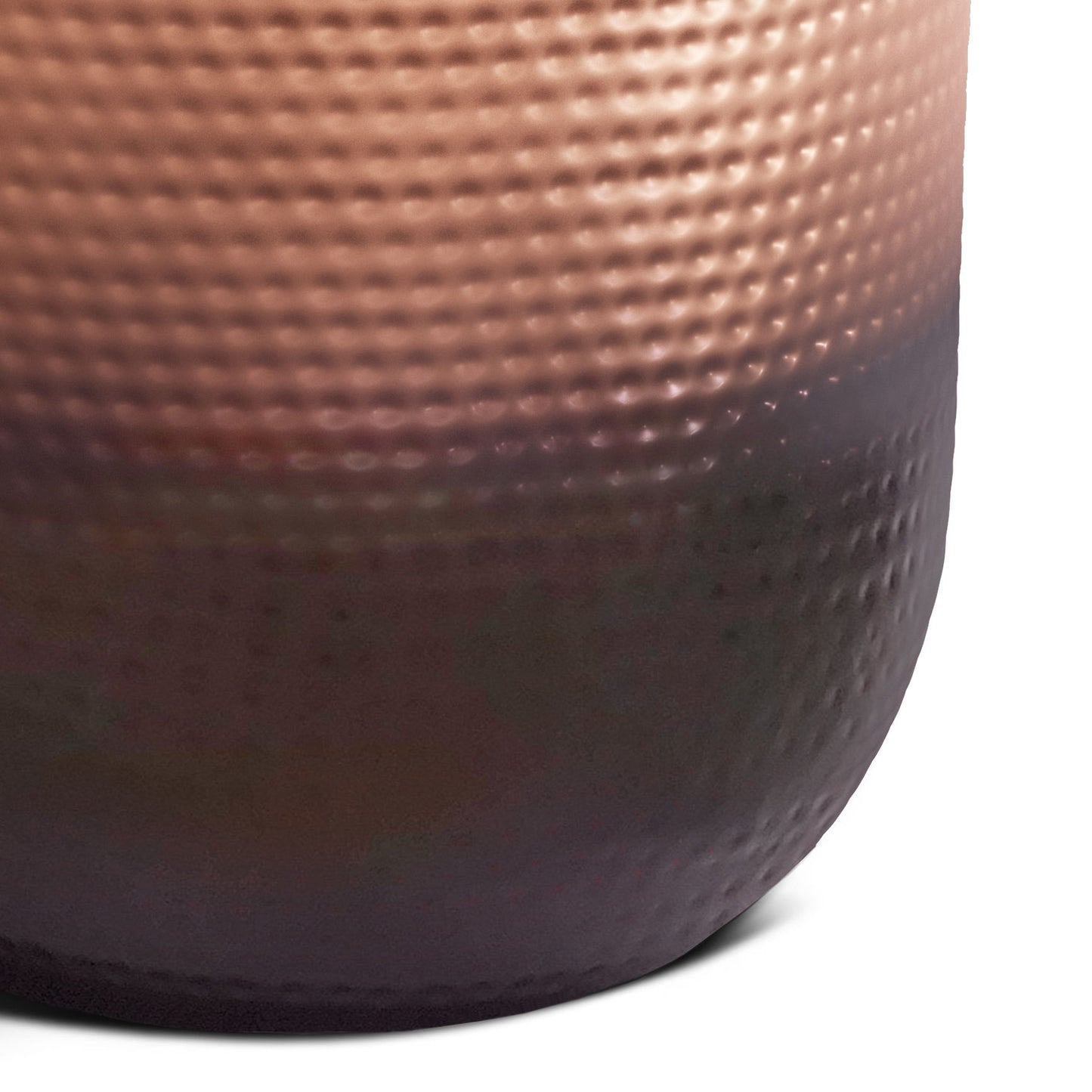 Close-up of the Nova - Handcrafted Metal Side Table, showcasing its rounded, dimpled surface with a metallic copper finish that darkens toward the base and features a pattern of small, raised dots.