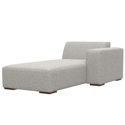 The Rex - Right Chaise Sofa Module in gray features modern upholstery, a low backrest, a right-side armrest, and short wooden block legs.