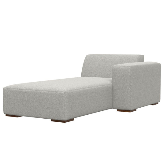 The Rex - Right Chaise Sofa Module in gray features modern upholstery, a low backrest, a right-side armrest, and short wooden block legs.