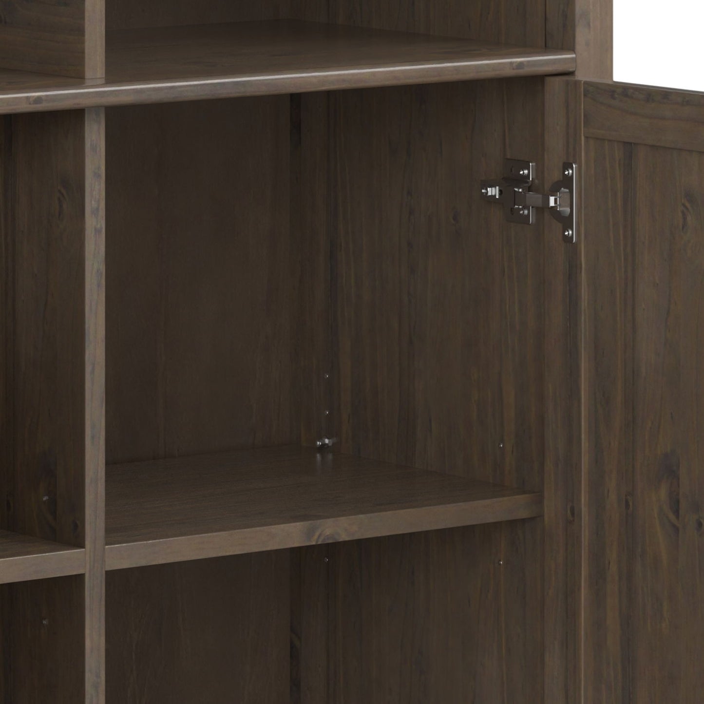 A close-up of the Lev - Medium Storage Cabinet in Smoky Brown, featuring two interior shelves and a metal hinge inside the right door. The empty cabinet is crafted from dark wood.