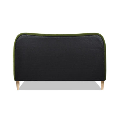 The Roman Curved Headboard Upholstered Platform Bed features dark upholstery, green trim along the top edge, and light wooden legs for a modern look.