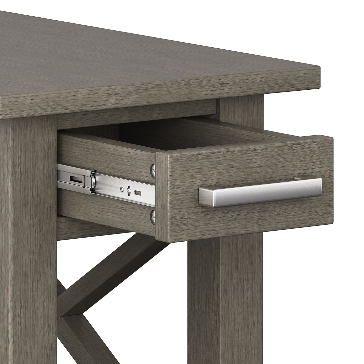 A close-up view of the Kitchener - Handcrafted Table shows its grayish wood finish and a partially open drawer with a metal handle and visible metal sliding mechanism.